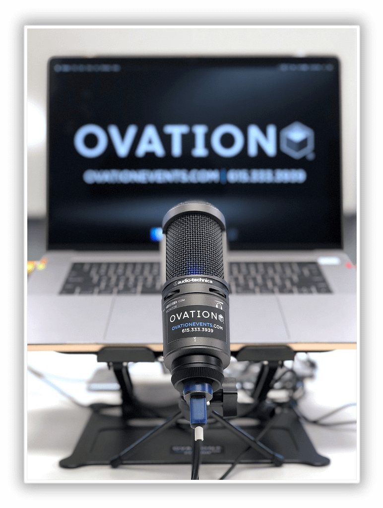 OVATION events microphone on stand with laptop